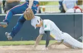  ?? JOHN SMIERCIAK/POST-TRIBUNE ?? Illiana Christian’s Gabe Van Roekel, right, takes out Calumet Christian pitcher Carter Tymm as he scores on a passed ball.