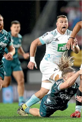  ?? GETTY IMAGES ?? Caleb Clarke, of the Blues, is tackled by Scott Gregory, of the Highlander­s, and at right, Tommy Talau, of the Wests Tigers, dives between two Bulldogs defenders to plant the ball, one-handed, over the line for his second try in a 34-6 win.