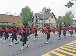  ?? WENDY ELLIOTT ?? Marching bands, especially those featuring bagpipes, are always parade favourites.