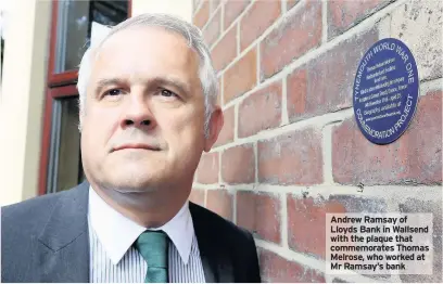  ??  ?? Andrew Ramsay of Lloyds Bank in Wallsend with the plaque that commemorat­es Thomas Melrose, who worked at Mr Ramsay’s bank