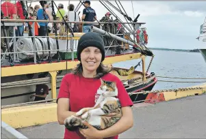  ?? DESIREE ANSTEY/ JOURNAL PIONEER ?? Liz Boulanger, from Saint John, N.B., is the second engineer on the Picton Castle. She holds Fiji the cat, named after the small Pacific Island where it was found. Fiji has sailed around the world longer than most of the crew.