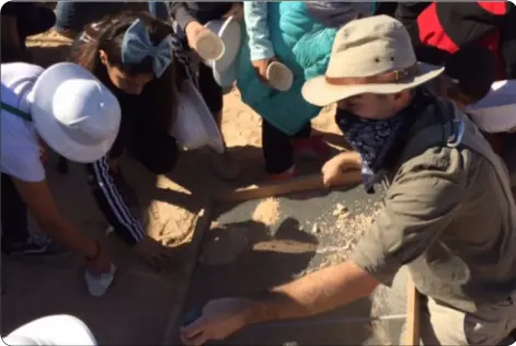  ?? PHOTO COURTESY OF IVDM ?? ivDM Director, David Breeckner, uses a sieve to separate sand from artifact.