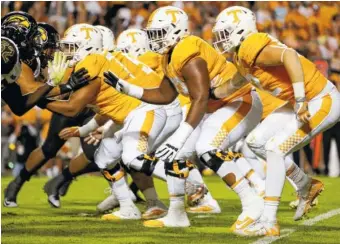  ?? STAFF PHOTO BY C.B. SCHMELTER ?? Tennessee’s offensive line blocks against Southern Mississipp­i during Saturday’s game at Neyland Stadium. The unit has struggled with injuries this season.