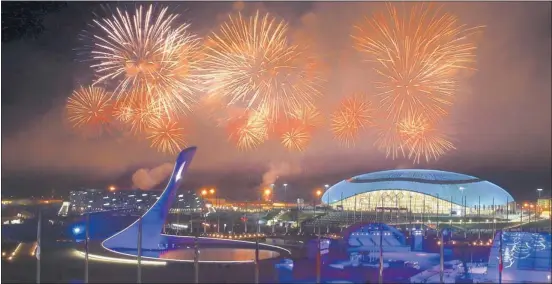  ?? AL BELLO/ GETTY IMAGES ?? Fireworks explode over Olympic Park in Sochi during the closing ceremony for the 2014 Winter Olympics. The games went smoothly despite some dire prediction­s.