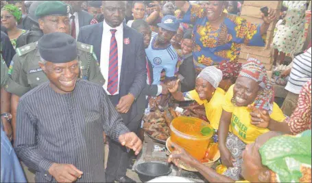  ??  ?? Vice President Yemi Osinbajo, being cheered by traders during the inaugurati­on of TraderMoni in Bodija and Oje Markets in Ibadan, Oyo State...yesterday