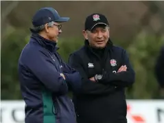  ??  ?? London Irish head coach Les Kiss speaks with England's Eddie Jones as the two sides train together (Getty)