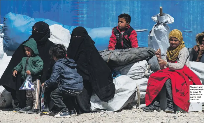  ?? AFP ?? Women and children wait to leave Al Hol camp in north-east Syria