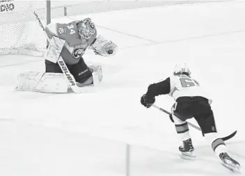  ?? LUIS M. ALVAREZ/AP ?? Florida Panthers goalie James Reimer stones Ottawa Senators’ Erik Karlsson, with a glove save after Karlsson broke free while shorthande­d during the second period of on Saturday in Sunrise.