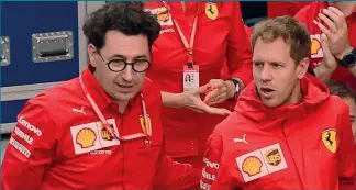  ?? AFP ?? Botta e risposta Mattia Binotto, team principal Ferrari, 50 anni, e Sebastian Vettel, 33 anni, in rosso dal 2015