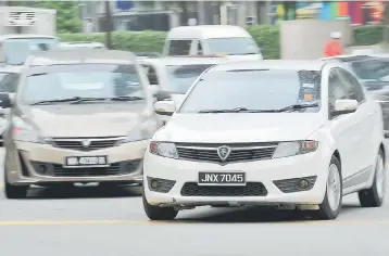  ??  ?? Proton Holdings Bhd, which wholly-owned Proton, signed an agreement with Zhejiang Geely Holdings Co Ltd last Wednesday in which Geely took up a 49.9 per cent stake and Proton retained the majority 50.1 per cent. — Bernama photo