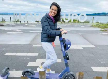  ?? Photo / Dan Hutchinson ?? Aucklander Julia Zhou tries out one of the new Beam e-scooters on the Taupō waterfront.