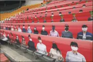  ?? Chung Sung-Jun / Getty Images ?? The stands at SK Wyverns club’s Happy Dream Ballpark, are filled with placards featuring their fans during the Korean Baseball Organizati­on (KBO) League game in May.