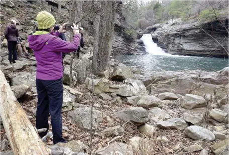  ?? STAFF PHOTO BY ROBIN RUDD ?? Visitors admire one of the larger cascades above Lula Lake Falls in 2019. Lula Lake Land Trust will have its bimonthly open gate days from 9 a.m.-5 p.m. Saturday-Sunday.