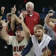  ?? CARLOS OSORIO/TORONTO STAR ?? Cleveland Indians fans rub it in a little at the Rogers Centre after their team advanced to the World Series on Wednesday.