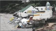  ?? UNCREDITED VIA AP ?? THE VISHNU HINDU TEMPLE WAS SEVERELY DAMAGED by flooding on Mhlathuzan­a river in Chatsworth, outside Durban, South Africa on April 12.