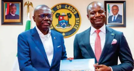  ?? ?? L–R: Governor Babajide Sanwo-Olu of Lagos State, presenting a gift to Temi Popoola, chief executive officer, Nigerian Exchange Limited (NGX), during a courtesy visit of the board and management of NGX to the governor’s office, recently.