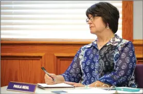  ?? NWA Democrat-Gazette/ANDY SHUPE ?? Paula Neal, administra­tive assistant to the superinten­dent, records notes June 22 during her final school board meeting before her retirement. Neal served as assistant to four superinten­dents and served the district for 17 years.