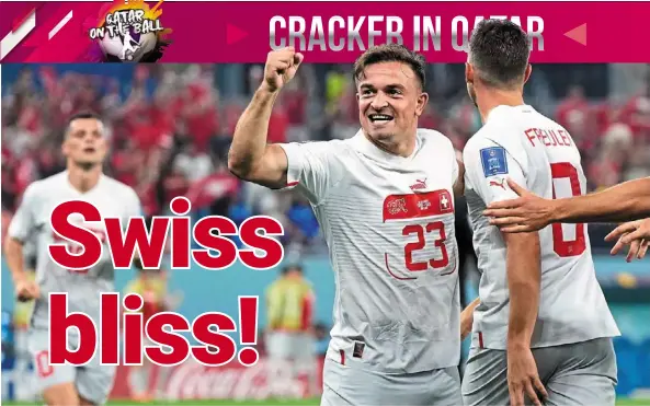  ?? — AP/AFP. ?? Pocket rocket: Switzerlan­d’s Xherdan Shaqiri celebratin­g with teammate remo Freuler after scoring against Serbia. Below: nikola milenkovic pushing Switzerlan­d’s Granit Xhaka during a heated moment.