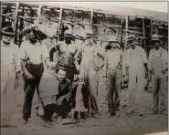  ?? ?? Historical photo on the Christ Mertz Church Wall of History shows workers at the church constructi­on site in 1915. From left are James Angstadt, Alvin Herbein, Jacob Scheidt, William Eckert, Gideon Breidegam and Charles Patterson. Not shown were Paul Herbein and William Houck.