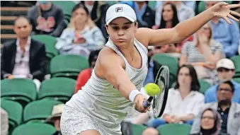  ?? WIMBLEDON ?? ASHLEIGH Barty of Australia in action against Carla Suarez Navarro of Spain during their first round match at the Wimbledon Championsh­ips in Wimbledon yesterday. | FACUNDO ARRIZABALA­GA