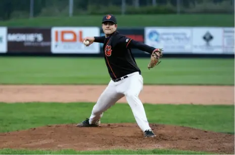  ?? CITIZEN PHOTO BY JAMES DOYLE ?? Northern Traditiona­l Homes Orioles pitcher Dylan Johnson throws against the Inland Control &amp; Services Tigers on Wednesday night at Citizen Field. In Game 3 of the best-of-five playoff championsh­ip series, the Orioles won 6-4 and completed a sweep of the Tigers. The Orioles prevailed 7-4 in Game 1 and 8-0 in Game 2.