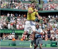  ?? AP ?? John Isner celebrates after winning the Miami Open. —