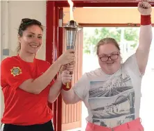  ??  ?? Right: Leona Sarsfield with the Special Olympics Flame of hope at the Drogheda Special Olympics Club and below, the torch arrives.