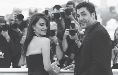  ?? ANNE-CHRISTINE POUJOULAT / AFP / GETTY IMAGES ?? Penelope Cruz and Javier Bardem, married since 2010, pose at a photocall in Cannes for their new film Todos Lo Saben (Everybody Knows).