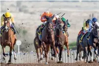  ?? ERA ?? Golden Jaguar, ridden by Connor Beasley, gallops to victory at Jebel Ali. —