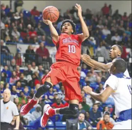  ?? The Sentinel-Record/Mara Kuhn ?? Fort Smith Northside junior Isaiah Joe (10) soars for a basket in the Class 7A state championsh­ip against North Little Rock Saturday at Bank of the Ozarks Arena. The Arkansas verbal commit scored 20 points to lead the Grizzlies to their 10th state title.