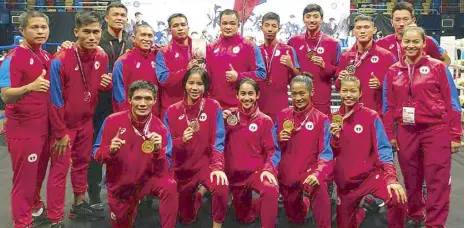  ??  ?? The triumphant Philippine Muay fighters display the medals won in their dominant showing in the East Asian Muaythai Championsh­ips in Hong Kong.