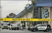  ?? AP/DAMIAN DOVARGANES ?? Police officers investigat­e Saturday after the fatal shooting at Gable House Bowl in Torrance, Calif.