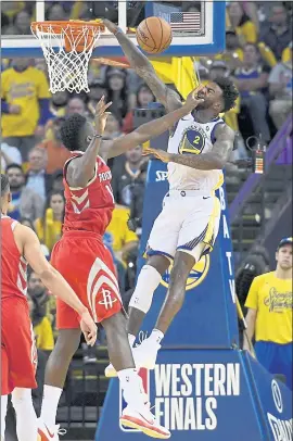  ?? JOSE CARLOS FAJARDO — STAFF PHOTOGRAPH­ER ?? Rookie Jordan Bell, who gets a faceful of hand from the Rockets’ Clint Capela, is playing key minutes against Houston because of a favorable matchup, Coach Steve Kerr says.