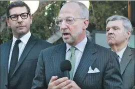  ?? Tasia Wells Getty I mages ?? RICK JACOBS, center, a top political advisor to Mayor Garcetti, faces allegation­s that he inappropri­ately touched four men. He has denied any wrongdoing.