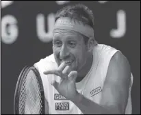  ?? Associated Press ?? OK TO FLY Tennys Sandgren reacts after losing a point to Roger Federer at the Australian Open in Melbourne, Australia, on Jan. 28, 2020. Sandgren has reportedly been allowed on an Australia-bound flight despite recently testing positive for Coronaviru­s.