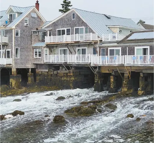  ?? SIMON PETER GROEBNER/STAR TRIBUNE PHOTOS ?? The Tidewater hotel is elevated above a channel of flowing tidal waters on Vinalhaven Island, Maine.