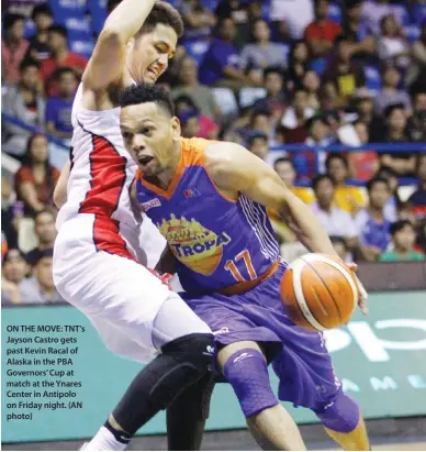  ??  ?? ON THE MOVE: TNT's Jayson Castro gets past Kevin Racal of Alaska in the PBA Governors’ Cup at match at the Ynares Center in Antipolo on Friday night. (AN photo)