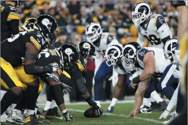  ?? THE ASSOCIATED PRESS ?? FILE - In this Nov. 10, 2019, file photo, the Pittsburgh Steelers offense, left, lines up against the Los Angeles Rams’ defense during the first half of an NFL football game in Pittsburgh. The NFL’s decision to expand the playoffs from 12 to 14 teams this season could have a major impact on the league based on how things have played out in the past.