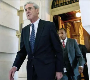  ?? ANDREW HARNIK — THE ASSOCIATED PRESS FILE ?? In this file photo, former FBI Director Robert Mueller, the special counsel probing Russian interferen­ce in the 2016 election, departs Capitol Hill following a closed door meeting in Washington.