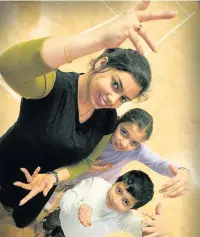  ??  ?? ●●Munmun Mukherjee taking a Bollywood dance session at Spotland Primary School with Sarish Akhtar and Muhammad Kamaran (both nine)