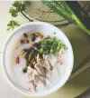  ??  ?? Unlike the feasts typical of Chinatown, Dollarbouf­fe serves “more affordable ... day-to-day food,” such as the rice porridge congee.