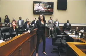  ?? Mark Wilson / Getty Images ?? U.S. Rep. Alexandria Ocasio-Cortez, D-N.Y., talks with fellow members during a House Oversight and Reform Committee hearing, on Thursday in Washington, D.C.