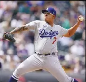  ?? Associated Press ?? DEALING
Los Angeles Dodgers starting pitcher Julio Urías works against the Colorado Rockies in the third inning on Sunday in Denver. Urías allowed one run on three hits with six strikeouts in seven innings and the Dodgers won 4-2.