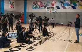  ?? (AP/Damian Dovarganes) ?? California Gov. Gavin Newsom takes questions from the media Sunday after a visit to Ramona Gardens Recreation Center in Los Angeles to discuss the state’s efforts to vaccinate hard-to-reach and disproport­ionately affected communitie­s. California’s new system of delivering and scheduling coronaviru­s vaccines is being rolled out in select counties. More photos at arkansason­line.com/222covid19/.