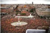  ?? PTI ?? Thousands of demonstrat­ors hold Spanish flags during a protest in Madrid, Spain, on Sunday