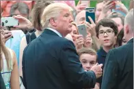  ?? NICHOLAS KAMM / AGENCE FRANCE-PRESSE ?? US President Donald Trump greets visitors at a Congressio­nal picnic event at the White House in Washington on Thursday.