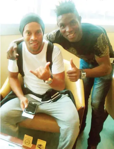  ??  ?? Remo Stars defensive midfielder, Felix Benjamin pose for a photograph with legendary Brazilian footballer, Ronaldinho