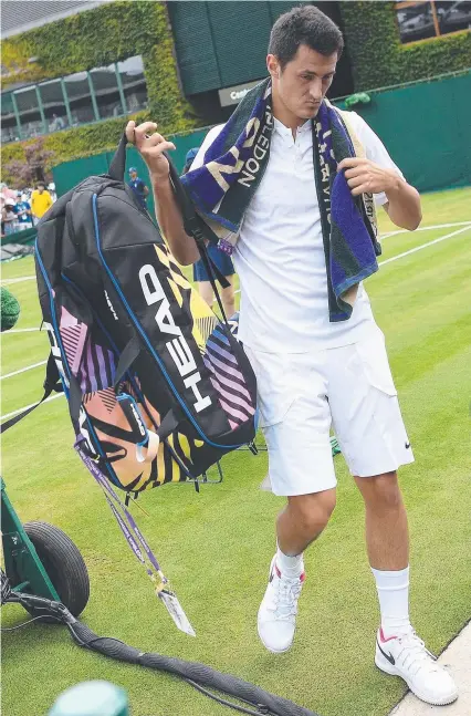  ??  ?? Bernard Tomic leaves the court after his controvers­ial loss to Germany's Mischa Zverev at Wimbledon,