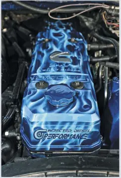  ??  ?? A custom airbrushed valve cover caps off the powerful Cummins to give the engine bay a truly unique look.