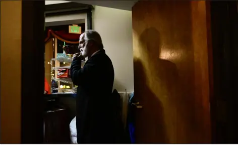  ?? PHOTOTS BY MATTHEW JONAS — DAILY CAMERA ?? Above: Scott Moore talks to the front of the house before taking the stage to perform his role of Ebenezer Scrooge at Jesters Dinner Theatre in Longmont on Friday. Moore has been playing the role of Scrooge for more than 35 years.